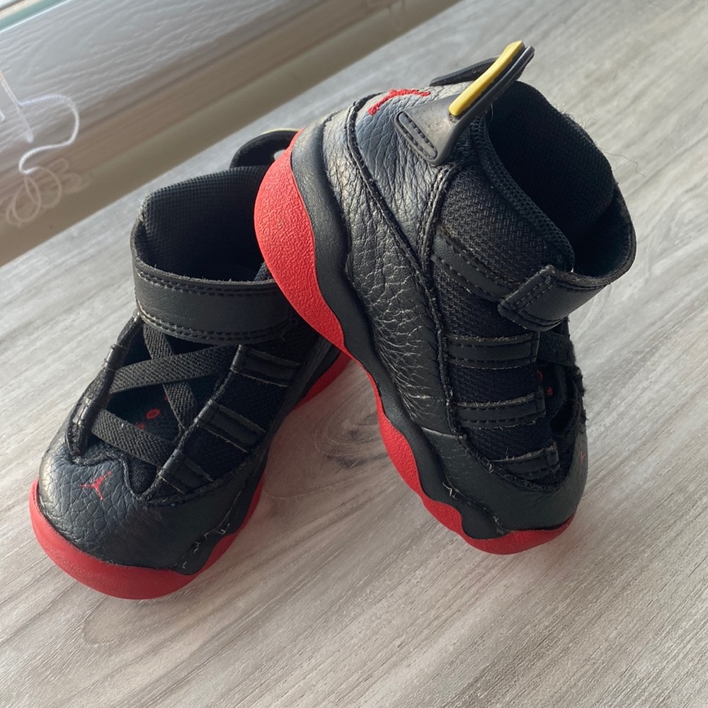 Infant black Jordans.